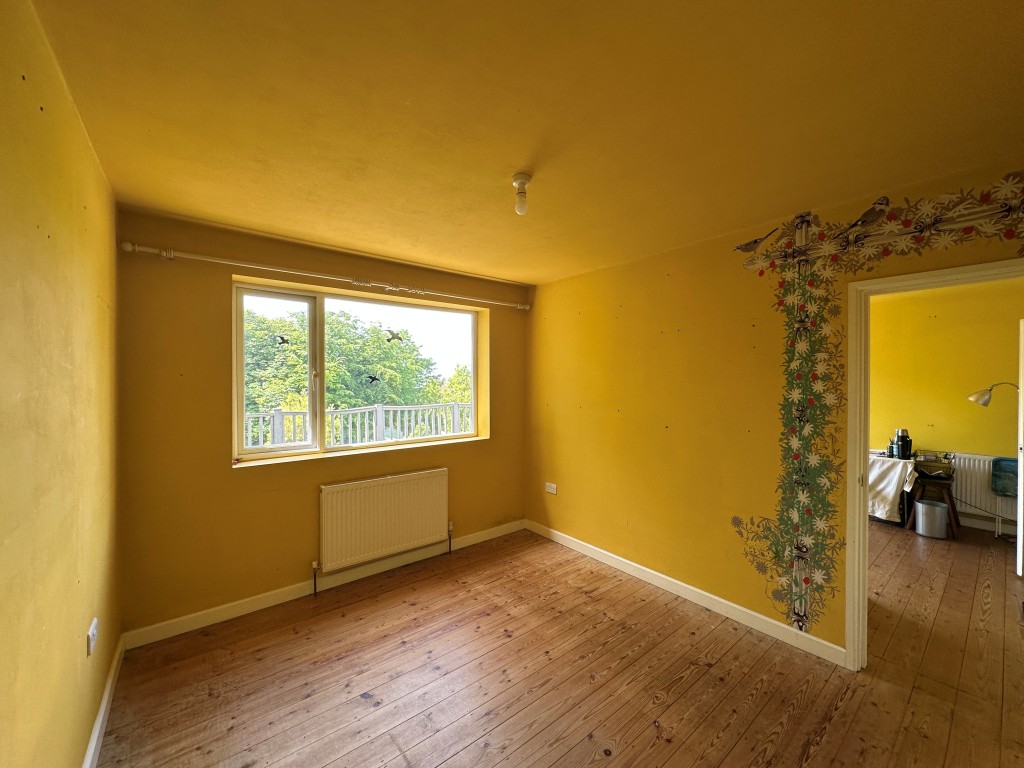 Lot: 125 - THREE-BEDROOM DETACHED HOUSE WITH POTENTIAL - Main Bedroom with window view over back garden